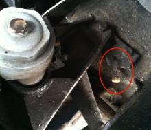 Steering stop bolt (near side)